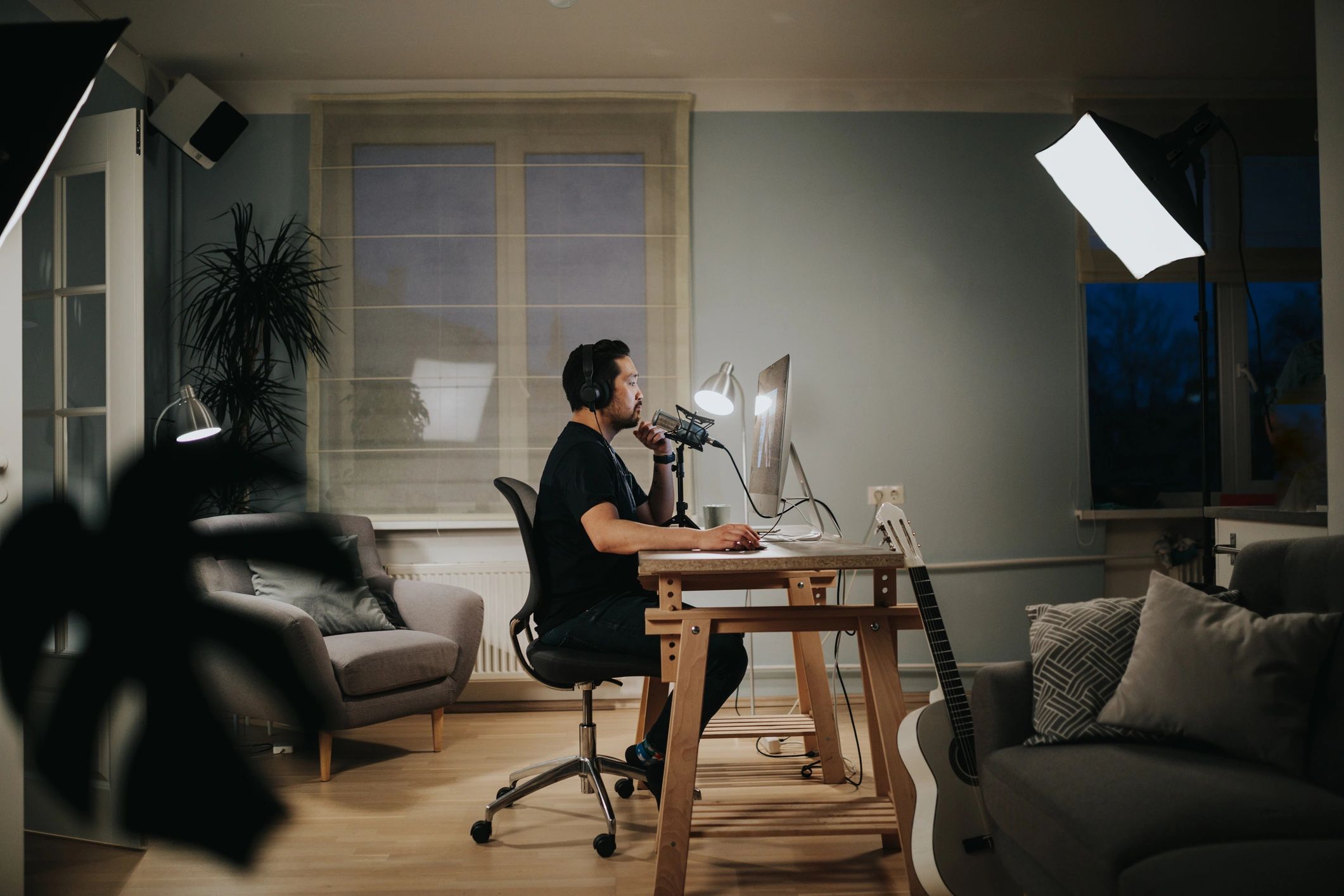 Customer support specialist with headset in a modern studio