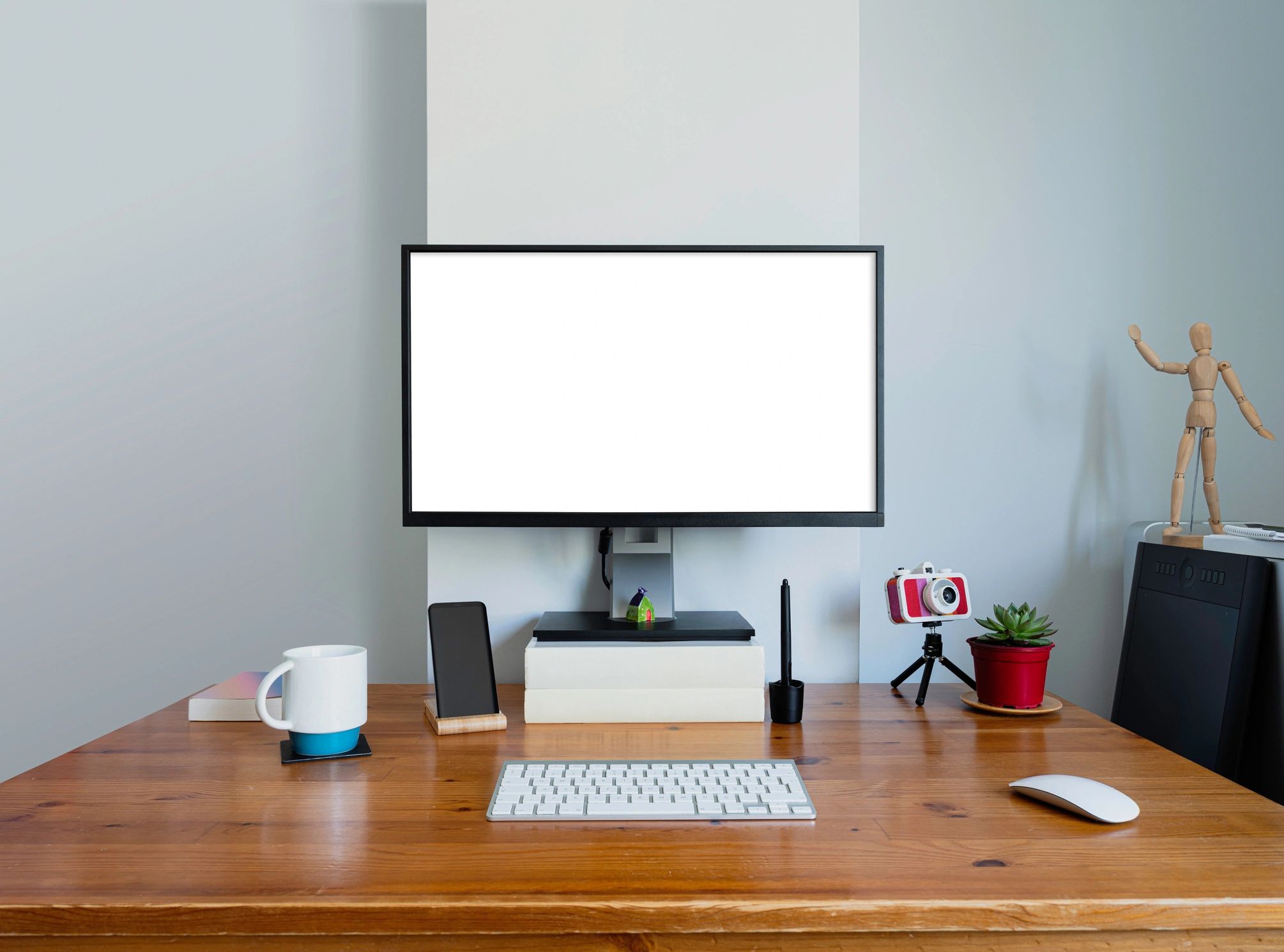Minimal home office monitor and workspace
